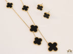 Gold plated necklace set with black enamel coated clovers
