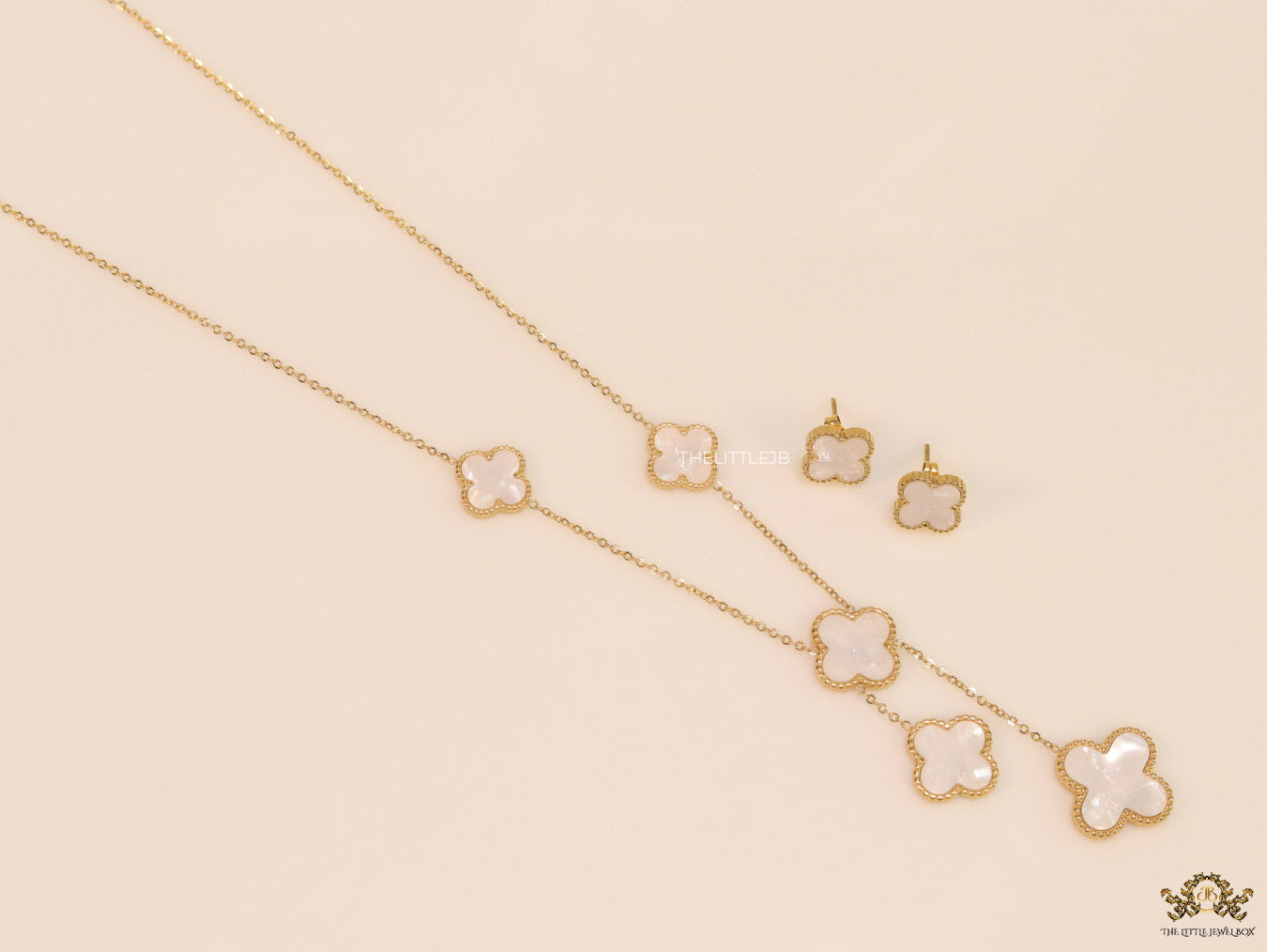 Gold plated necklace set with mother of pearl clovers