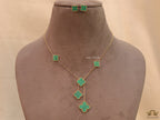Gold plated necklace set with malachite green clovers