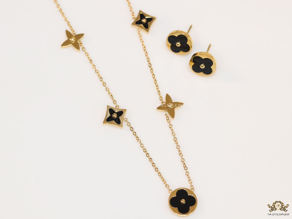 Clover necklace set in black enamel and gold plating