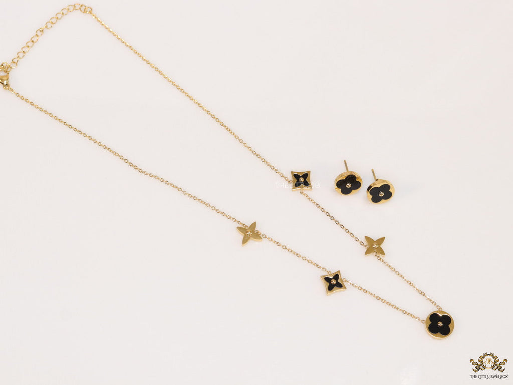 Clover necklace set in black enamel and gold plating