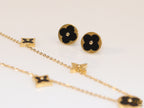 Clover necklace set in black enamel and gold plating
