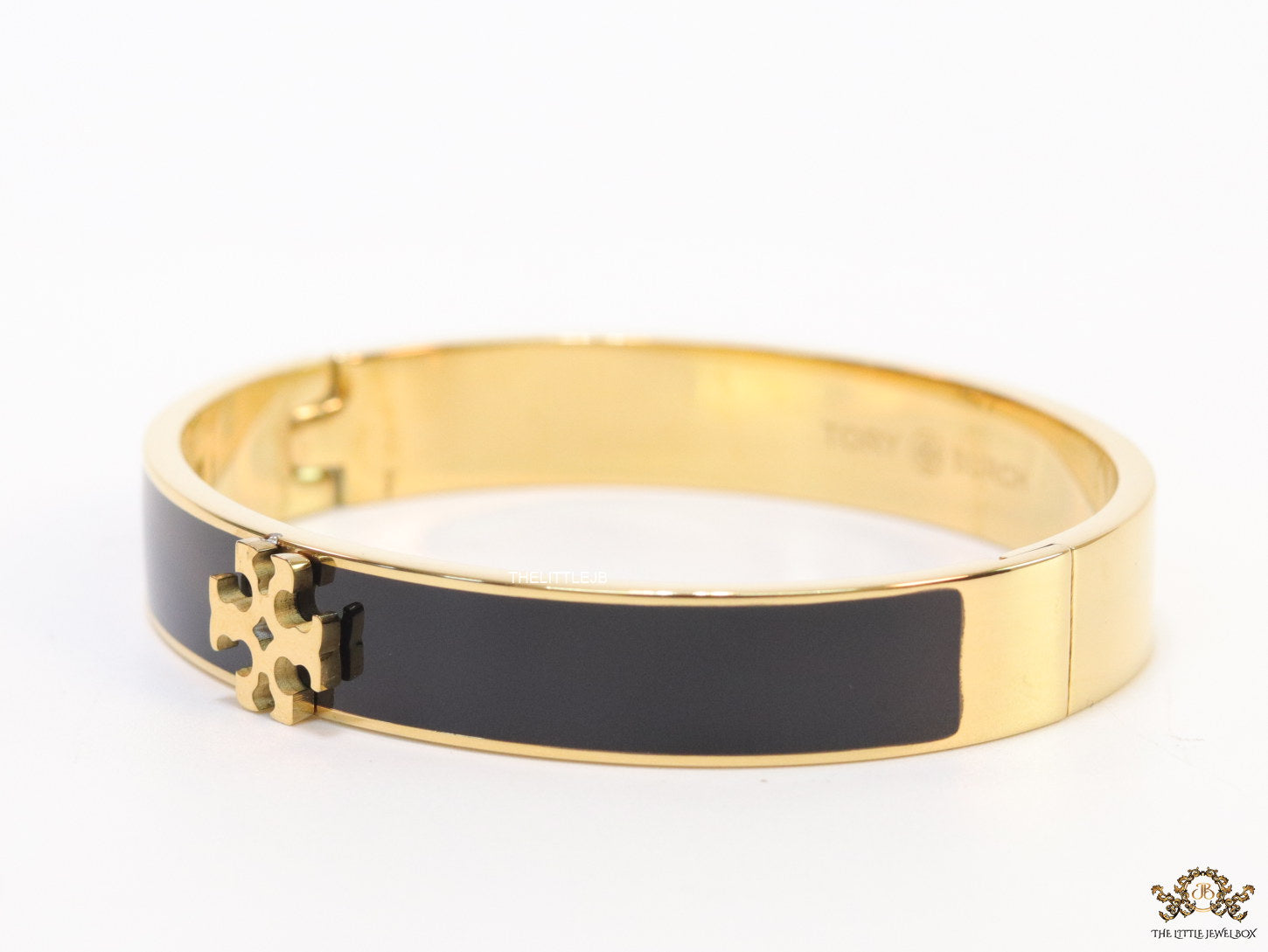 Golden and black bracelet with T motif