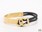 Black and golden designer bracelet with twin C motif