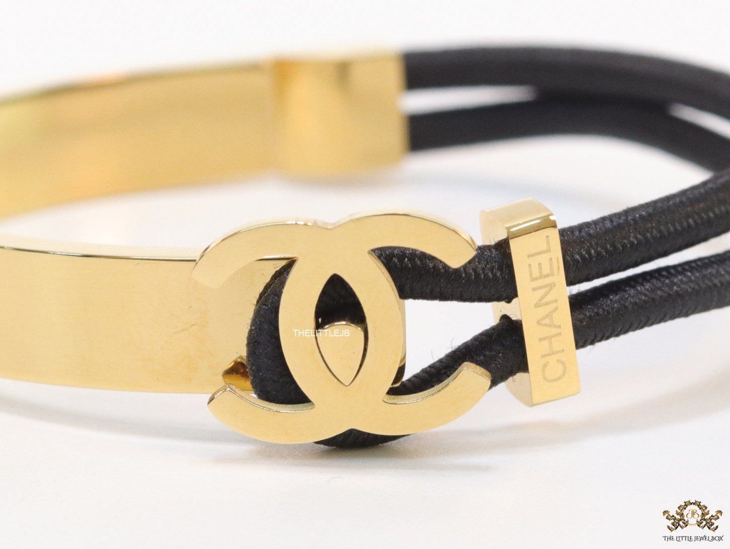 Black and golden designer bracelet with twin C motif