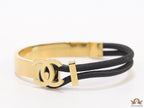 Black and golden designer bracelet with twin C motif