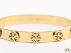 Gold plated bracelet with twin T motifs