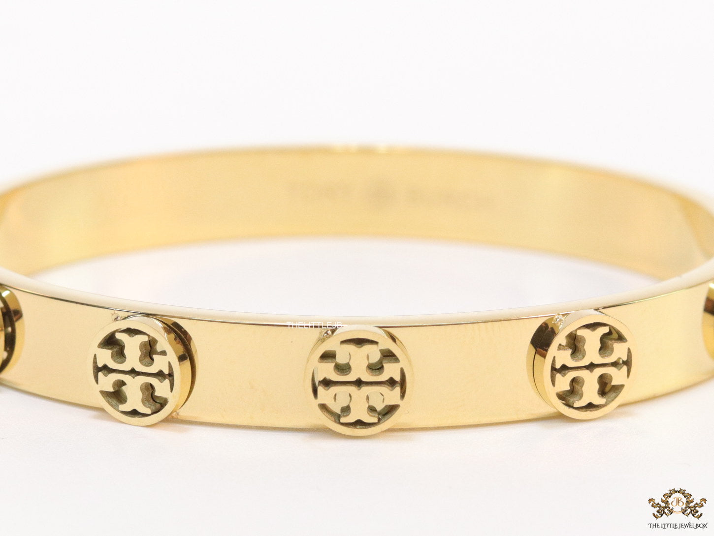 Gold plated bracelet with twin T motifs