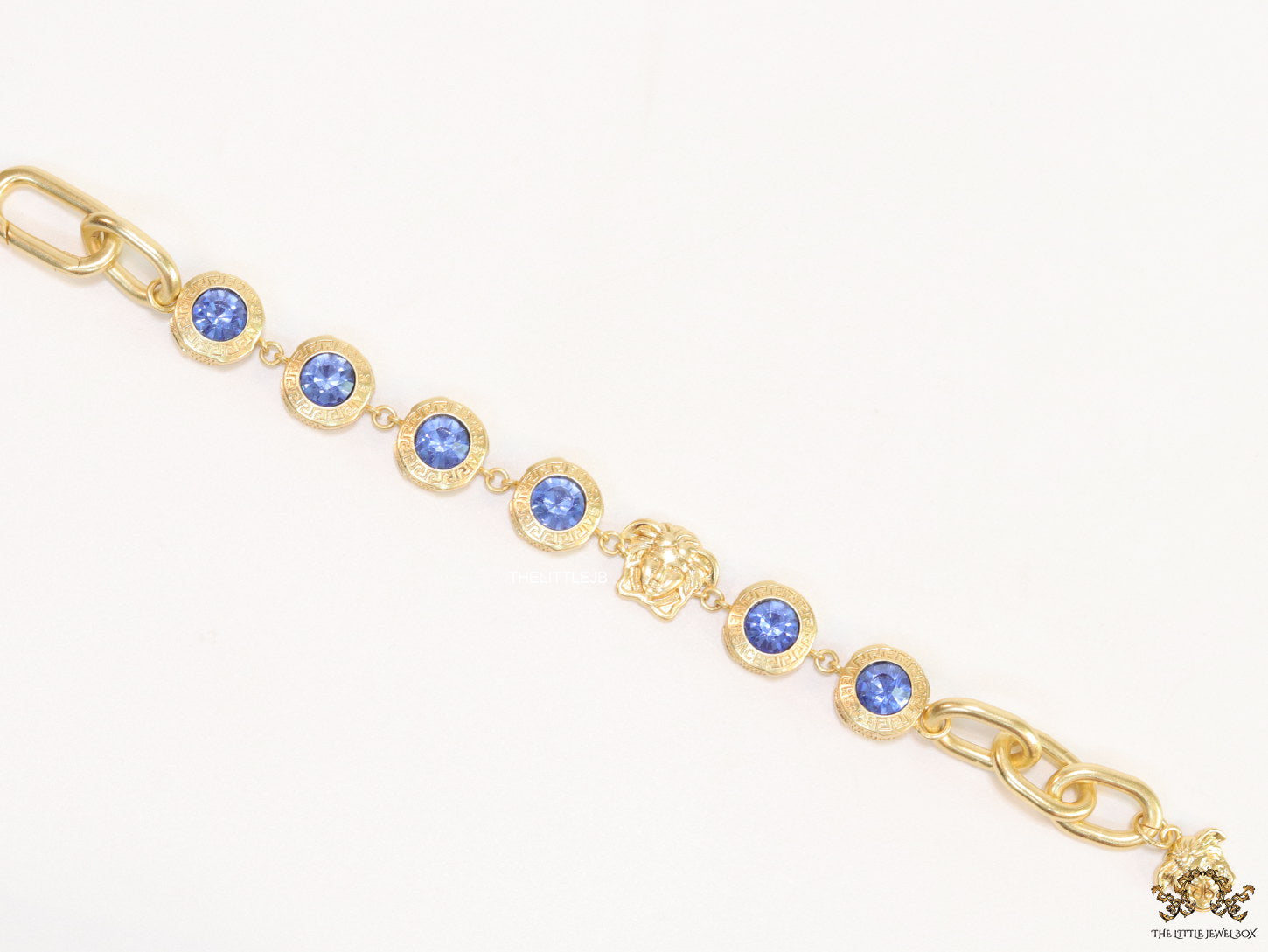 Designer golden Medusa chain bracelet with fancy cut cz