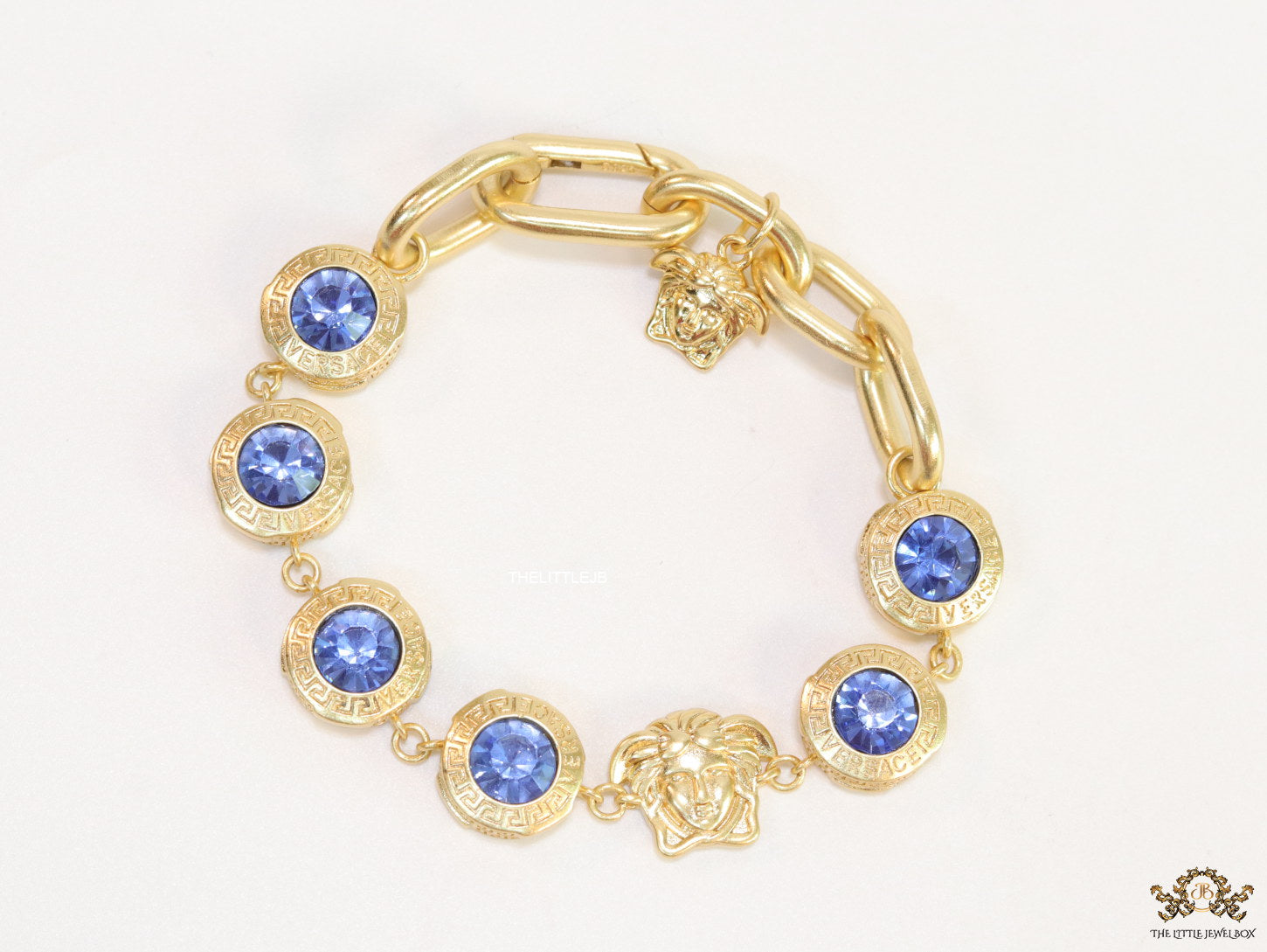 Designer golden Medusa chain bracelet with fancy cut cz