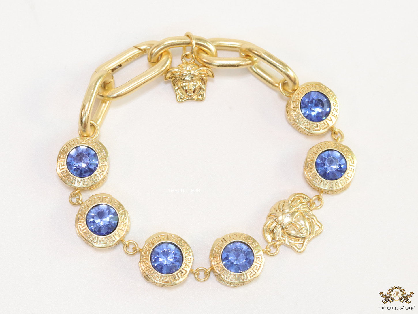 Designer golden Medusa chain bracelet with fancy cut cz
