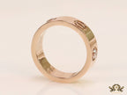 Broad 6mm rose gold band with screws and stones