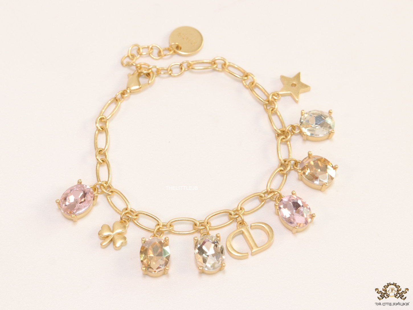 Golden chain bracelet with alphabet and cz charms