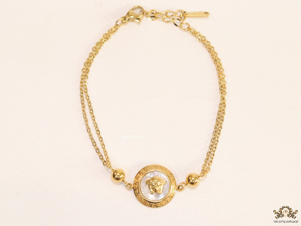Double chain Medusa bracelet in gold