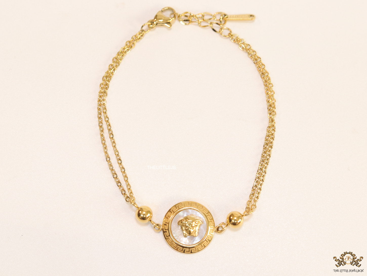 Double chain Medusa bracelet in gold