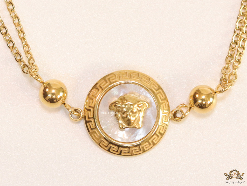 Double chain Medusa bracelet in gold
