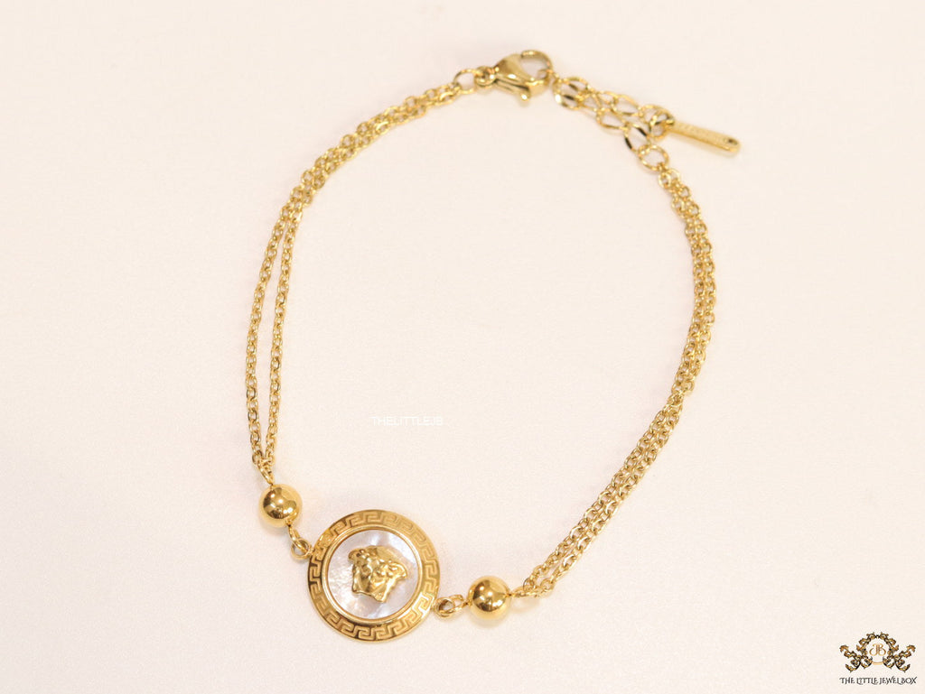 Double chain Medusa bracelet in gold
