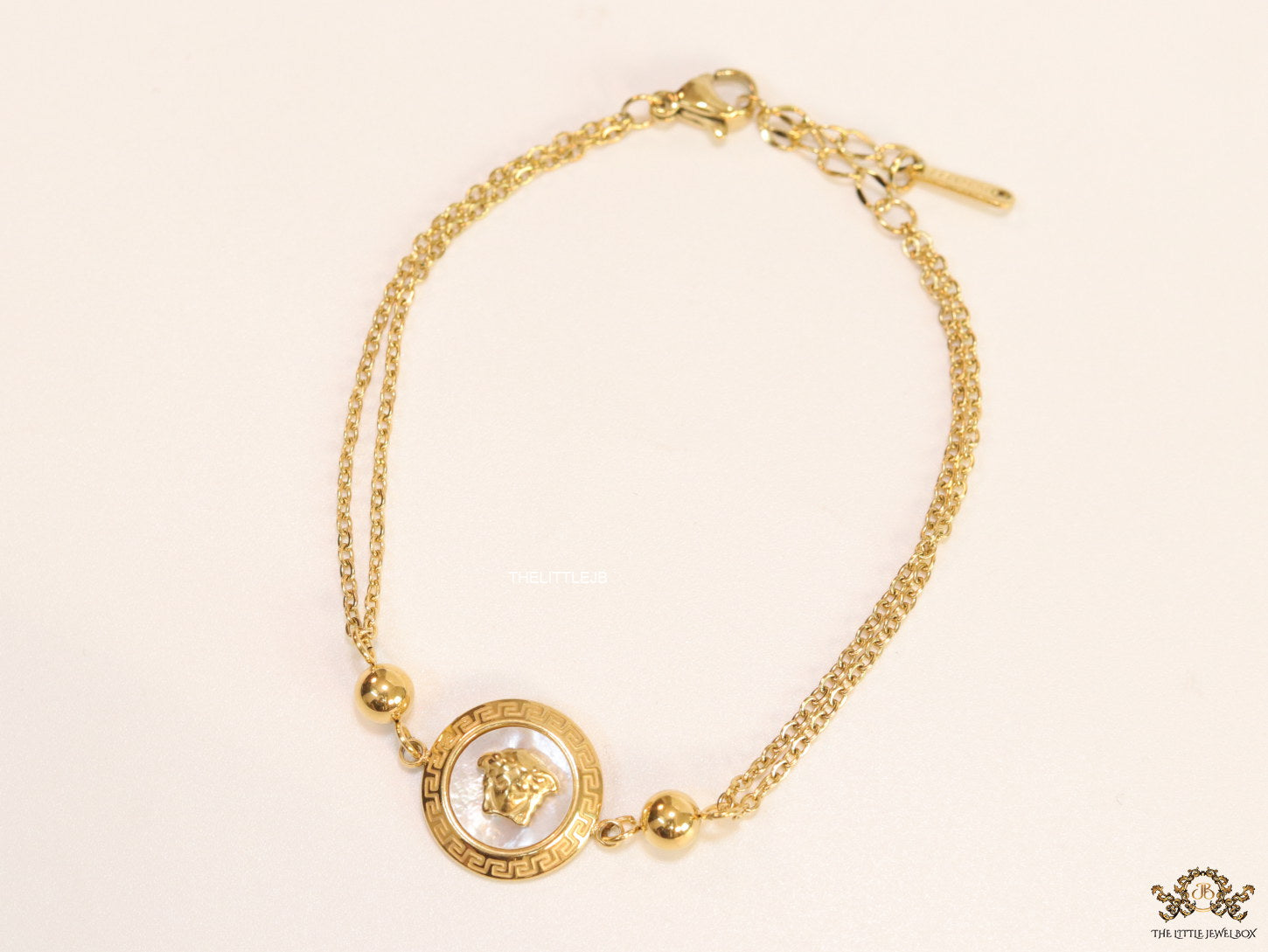 Double chain Medusa bracelet in gold