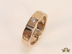 Narrow 4.5mm rose gold band with screws and stones