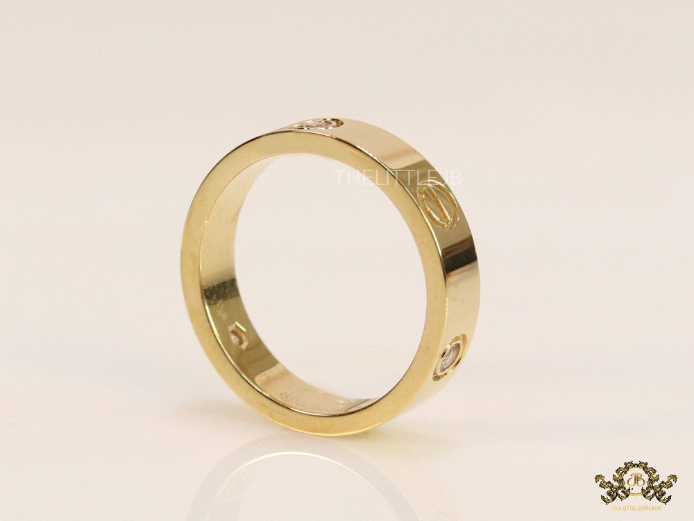 Narrow 4.5mm gold band with screws and stones