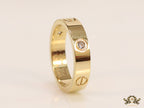 Narrow 4.5mm gold band with screws and stones