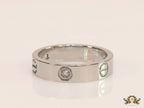 Narrow 4.5mm platinum plated band with screws and stones