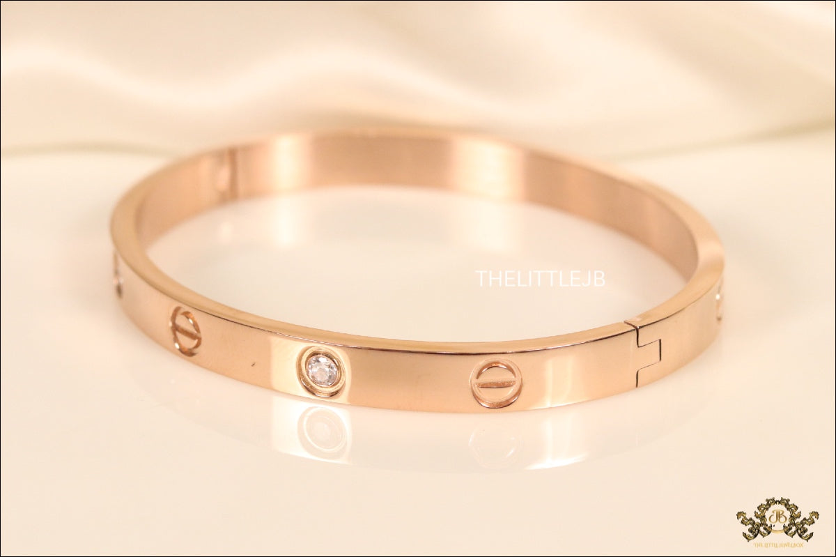 Women's Rose Gold Plated bracelet with screws and zircons