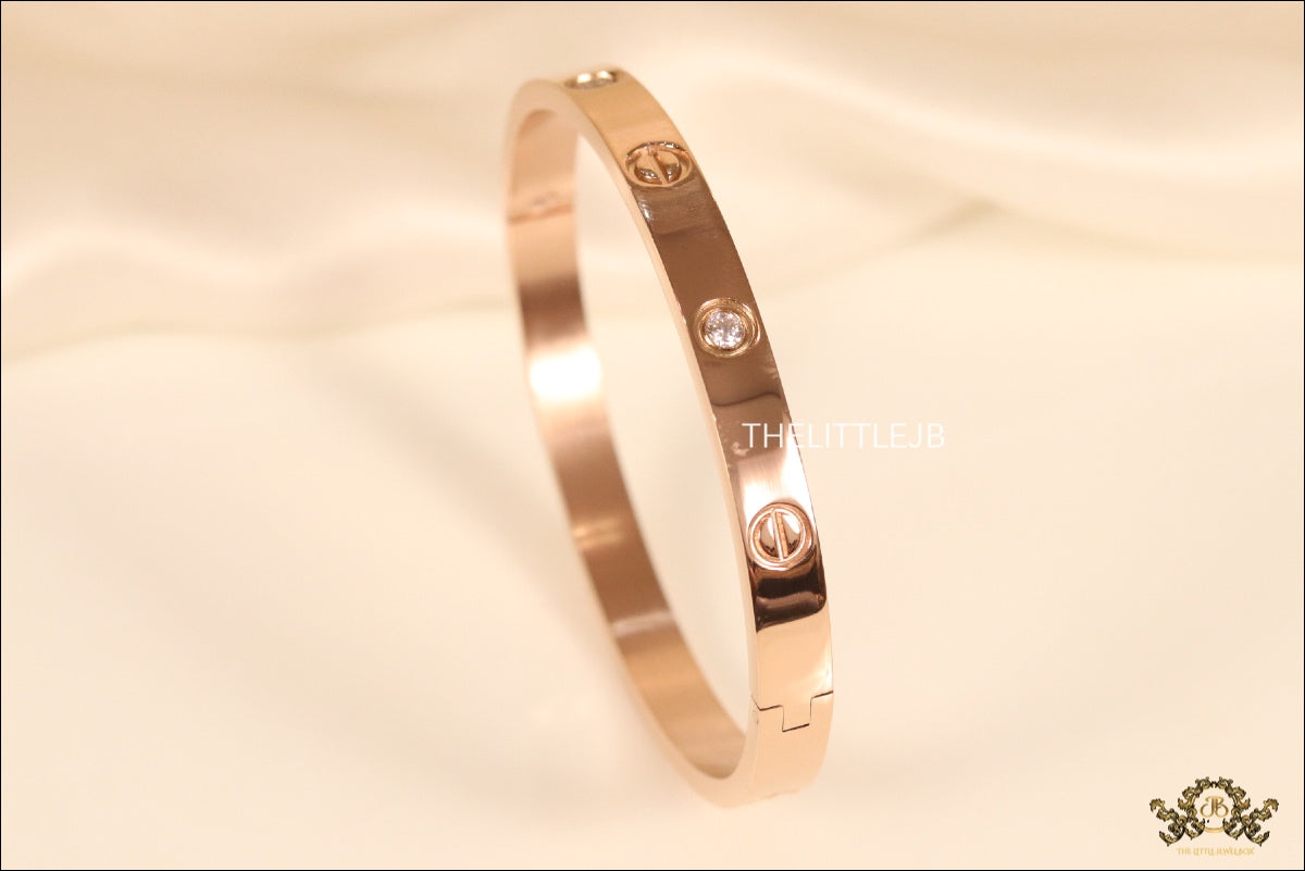 Women's Rose Gold Plated bracelet with screws and zircons