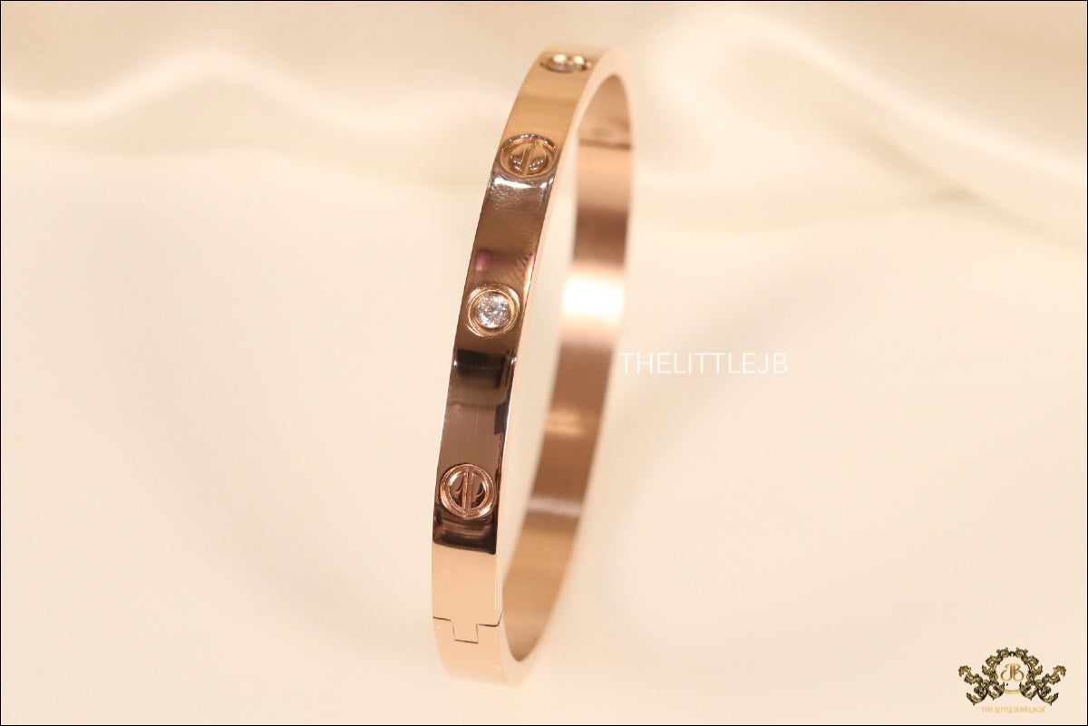 Women's Rose Gold Plated bracelet with screws and zircons