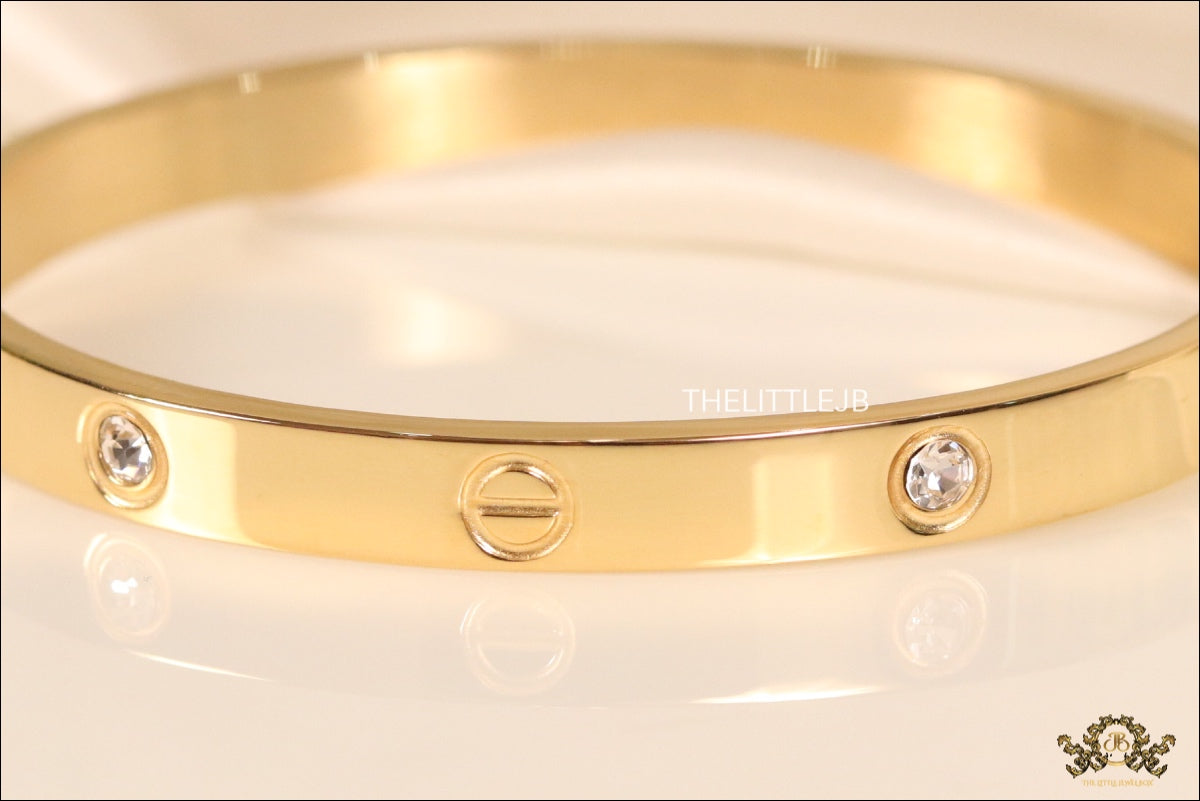 Women's Gold Plated bracelet with screws and zircons