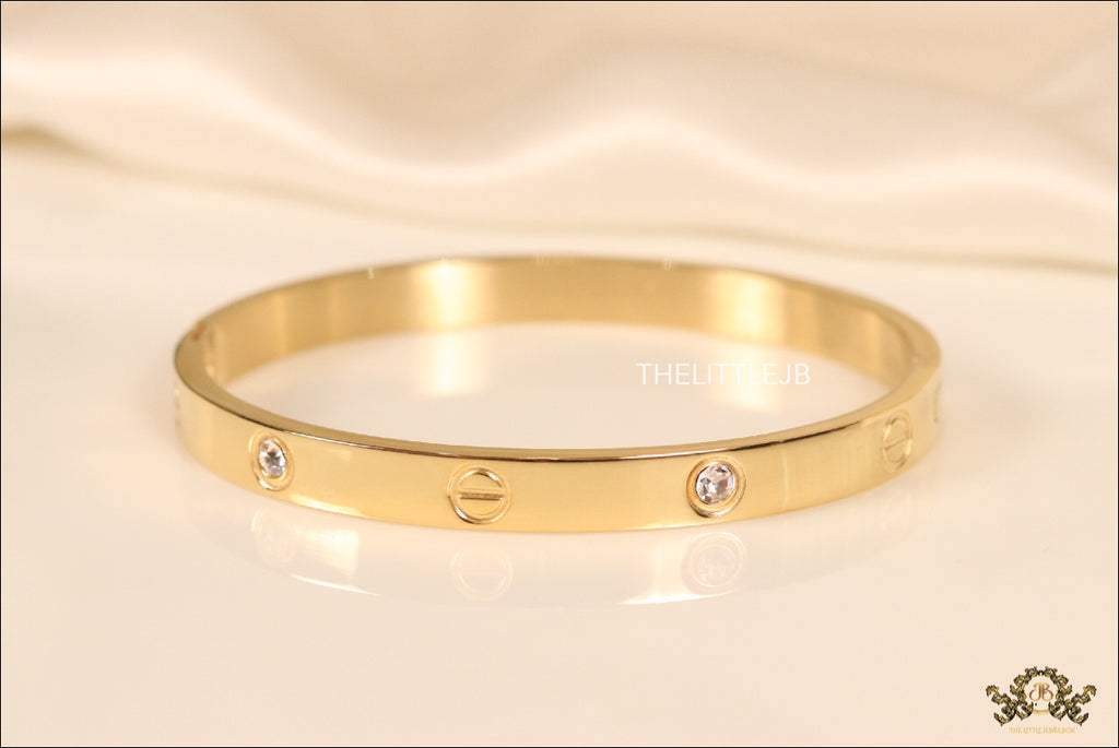 Women's Gold Plated bracelet with screws and zircons