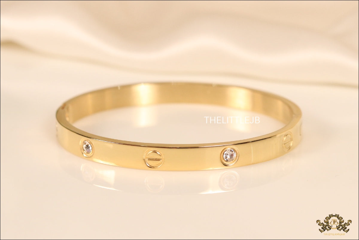 Women's Gold Plated bracelet with screws and zircons