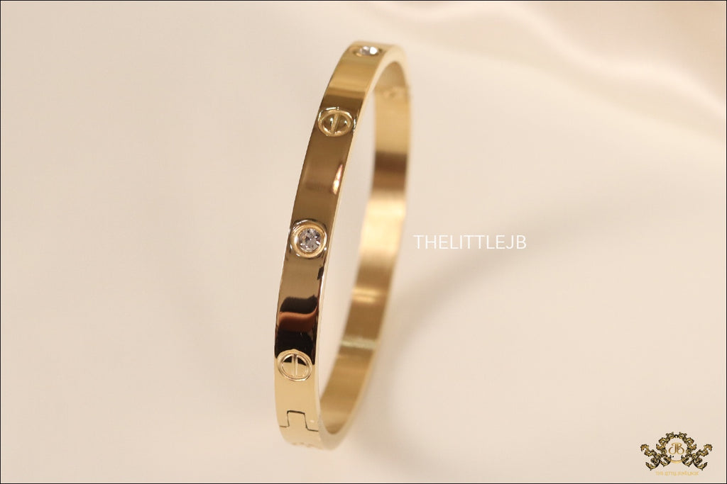 Women's Gold Plated bracelet with screws and zircons