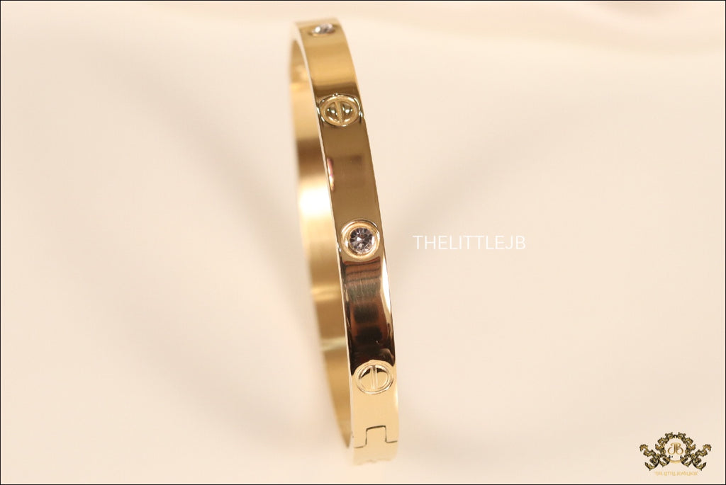 Women's Gold Plated bracelet with screws and zircons