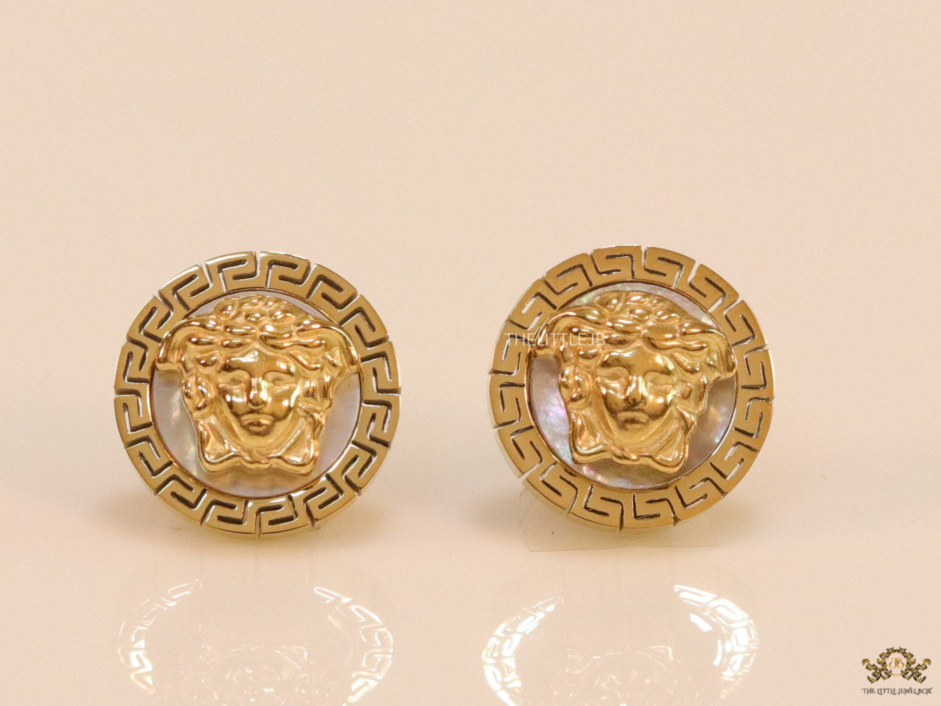 Gold plated Medusa studs in white enamel coating