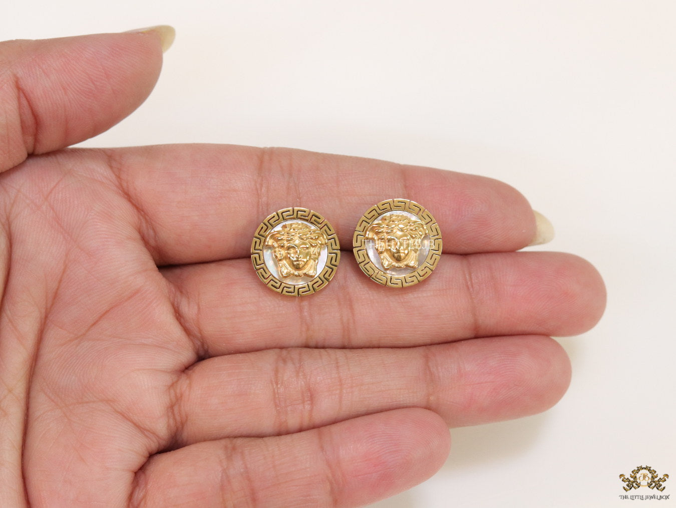 Gold plated Medusa studs in white enamel coating