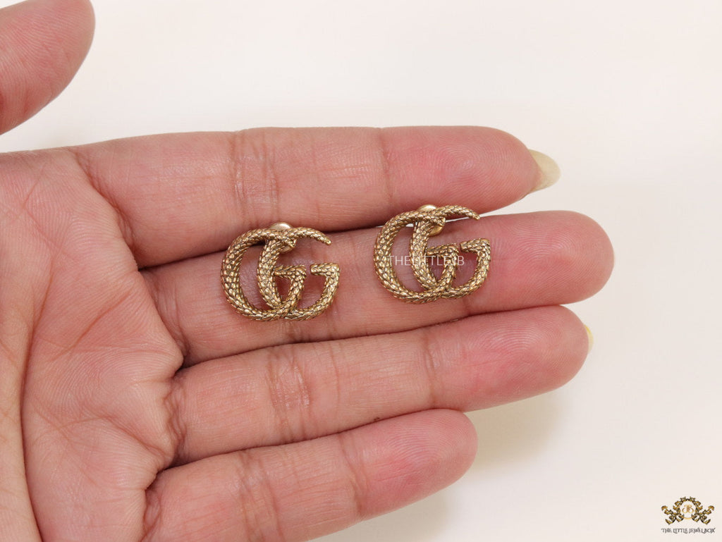 Gold plated earrings with double G initials