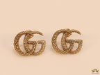 Gold plated earrings with double G initials