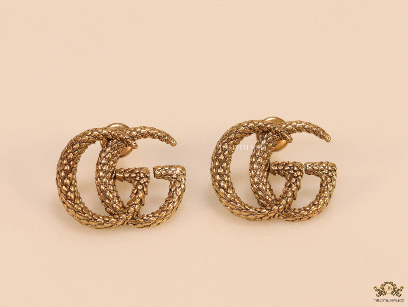 Gold plated earrings with double G initials
