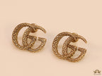 Gold plated earrings with double G initials