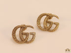 Gold plated earrings with double G initials
