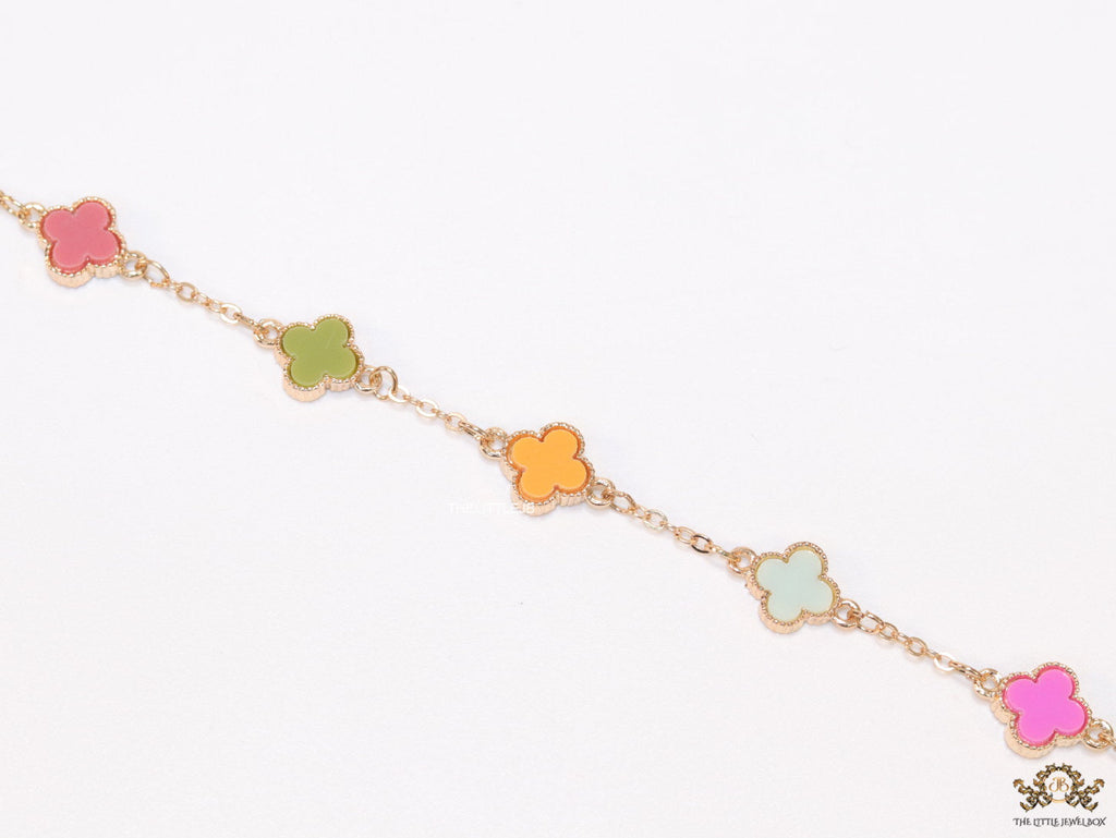 Golden chain bracelet with multi colored clovers