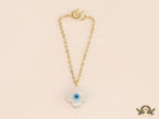Clover leaf shaped mother of pearl watch charm with evil eye and gold plated chain