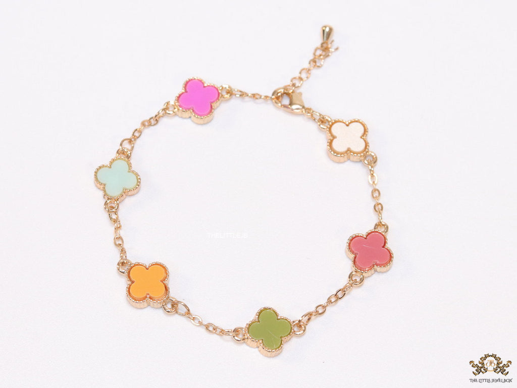 Golden chain bracelet with multi colored clovers