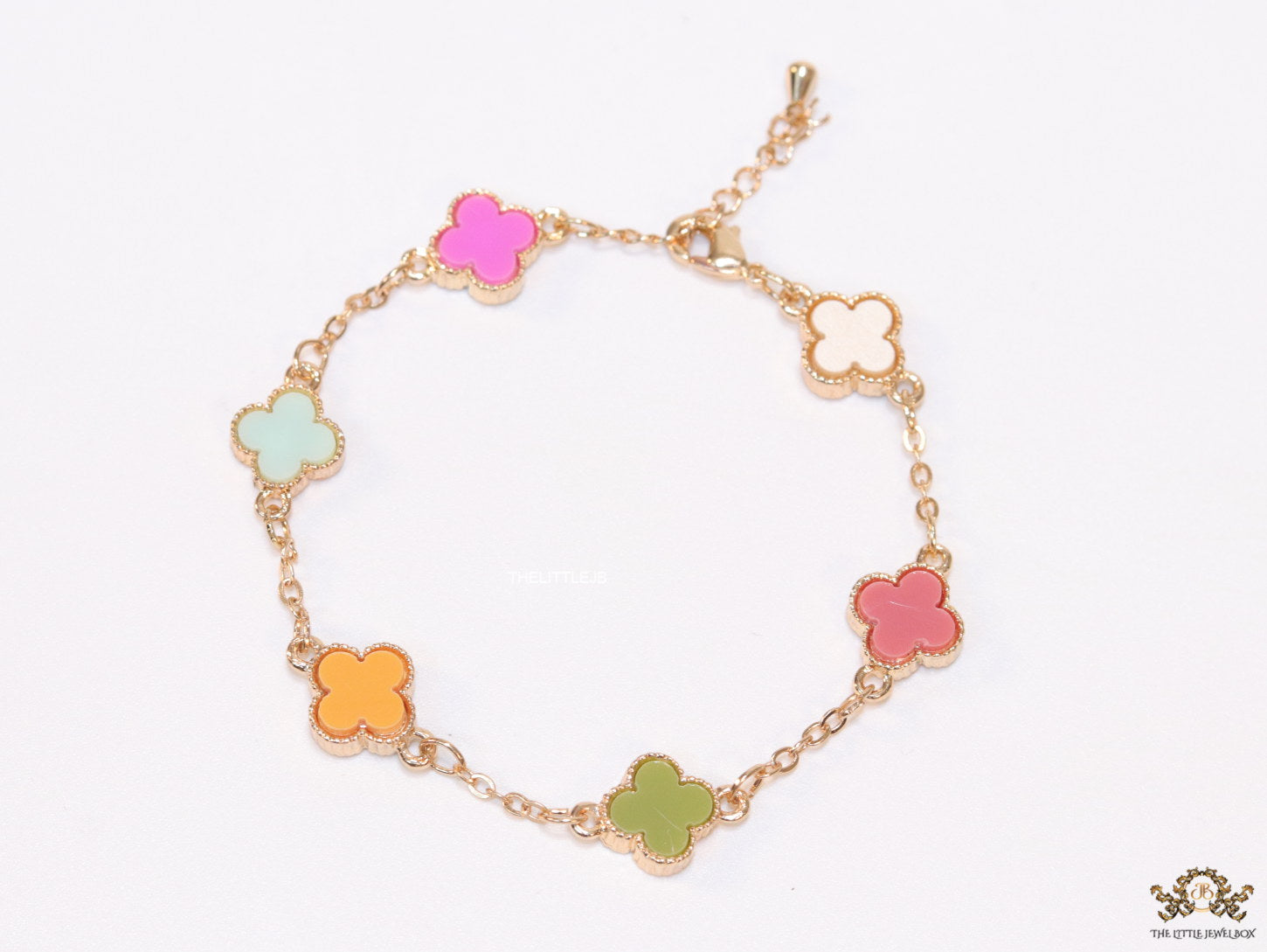 Golden chain bracelet with multi colored clovers