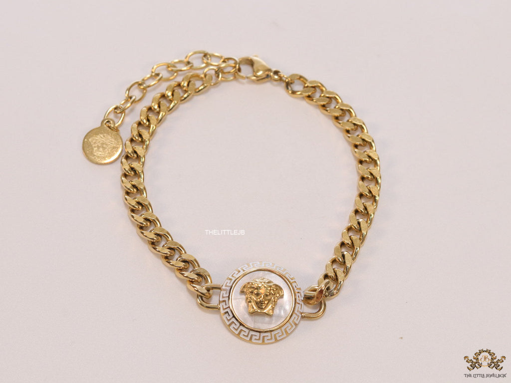 Golden link chain bracelet with Medusa motif centre