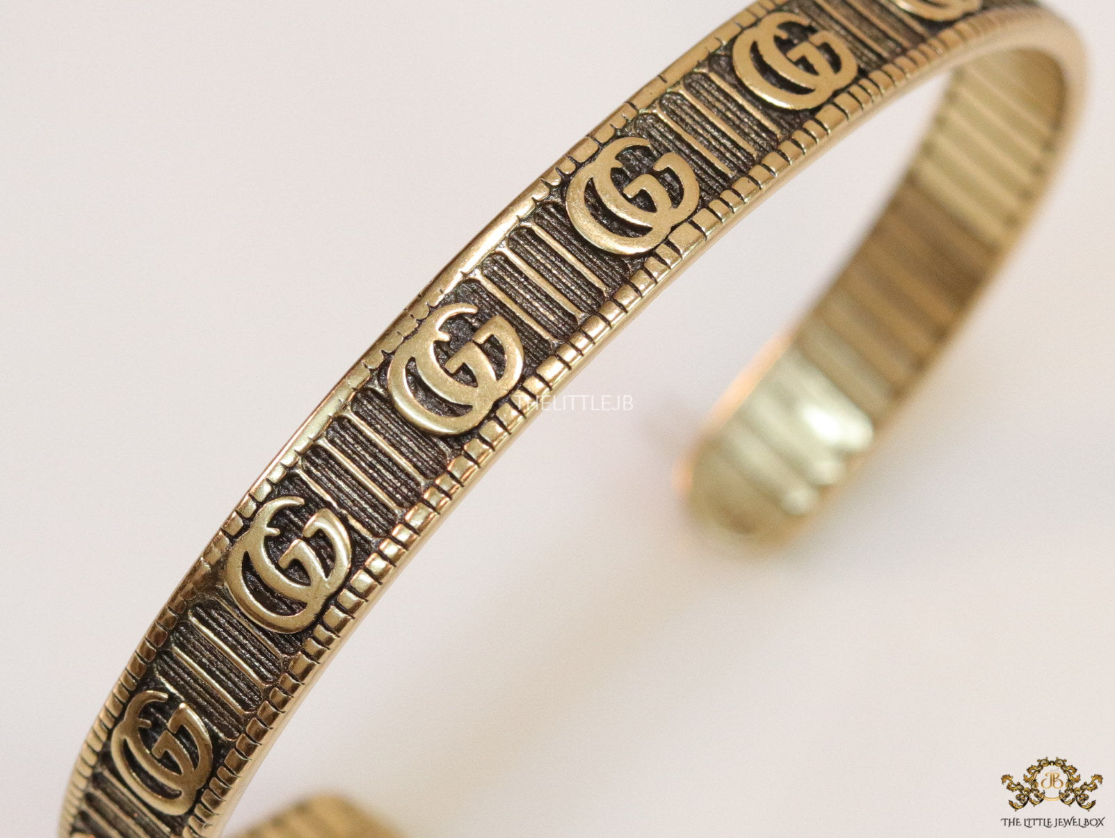 Open Gold plated double G motif bracelet in antique finish