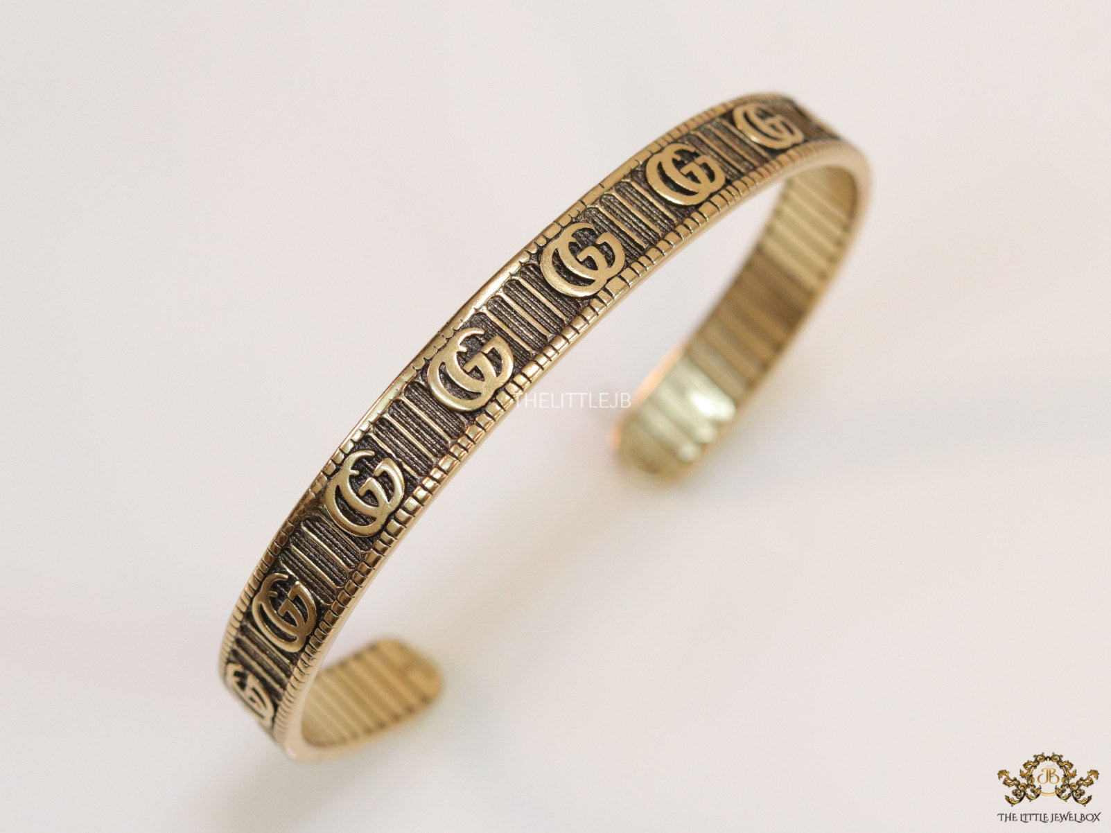 Open Gold plated double G motif bracelet in antique finish