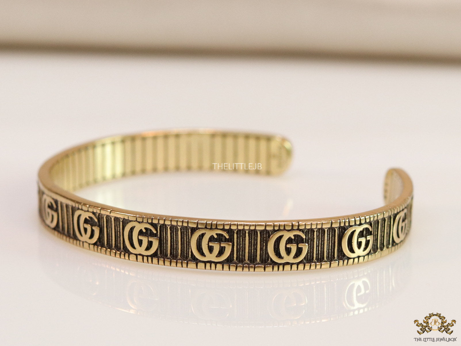 Open Gold plated double G motif bracelet in antique finish