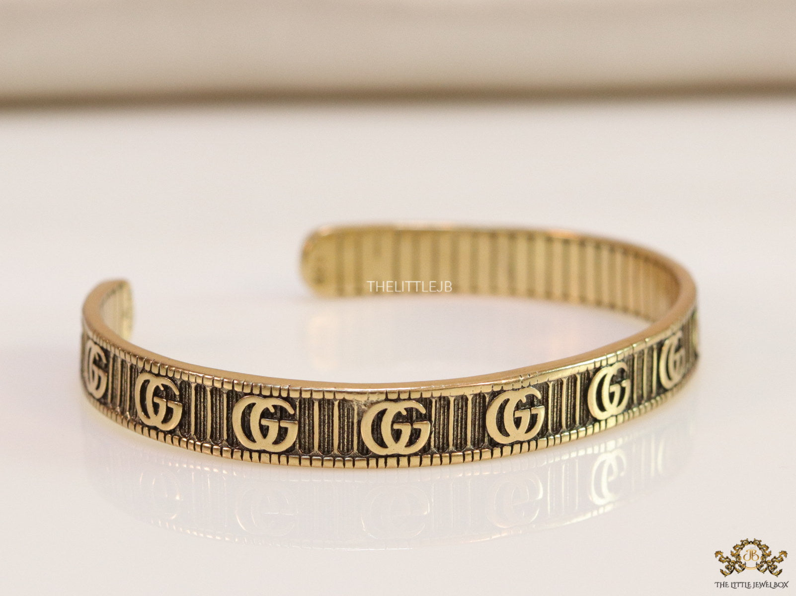 Open Gold plated double G motif bracelet in antique finish